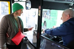 Customer using leapcard to pay driver on bus