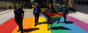 Dublin Bus employees holding pride flag