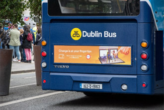 Image of back of bus with advertisement