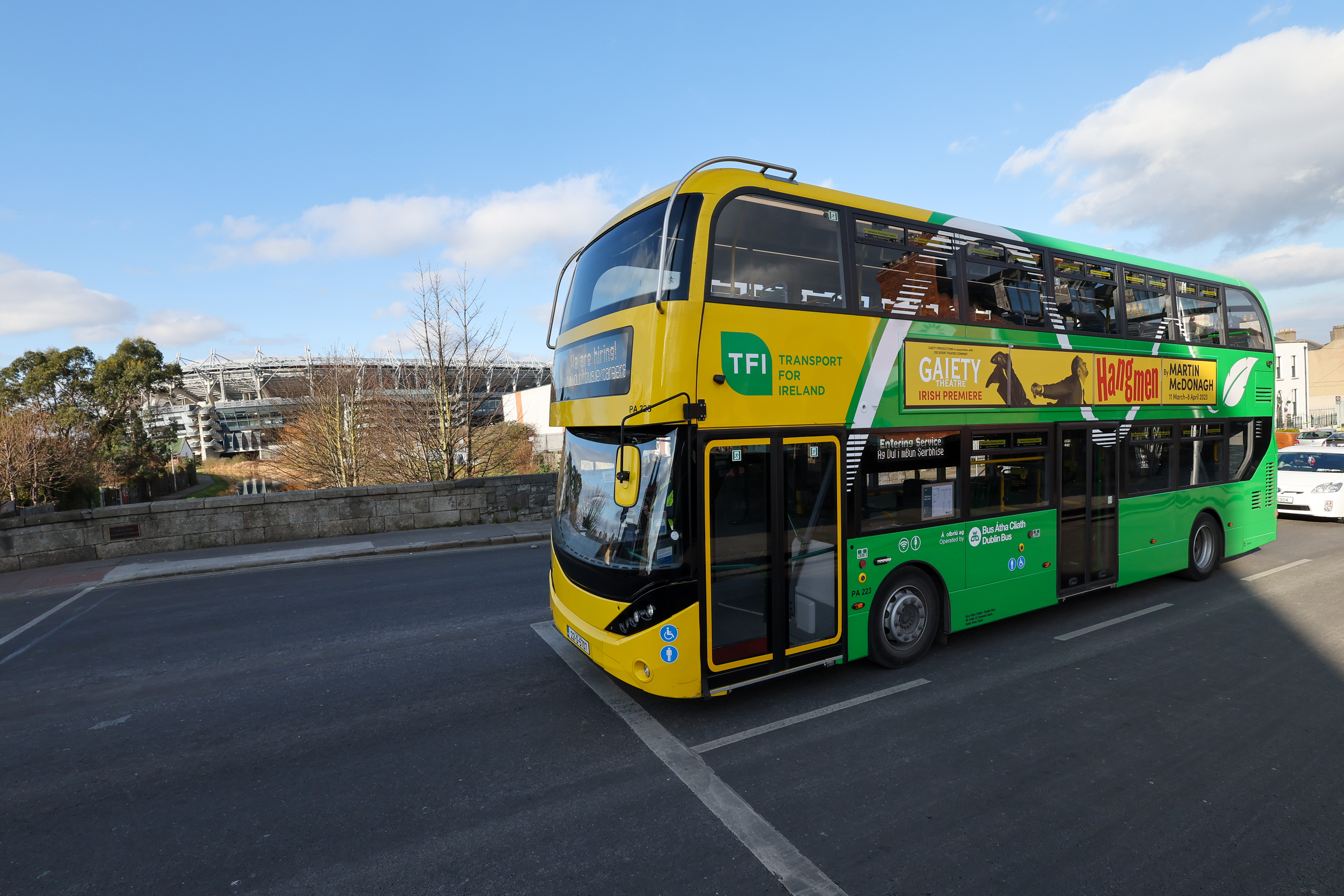 Side view of parked Dublin Bus in a bus depot