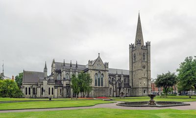 Scenic image of St. Patrick’s Cathedral, showing grass and the historical building