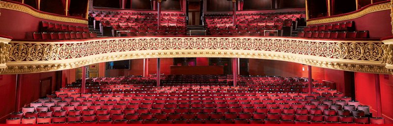 View from the stage inside the Gaiety Theatre, showing the seats and balconies.