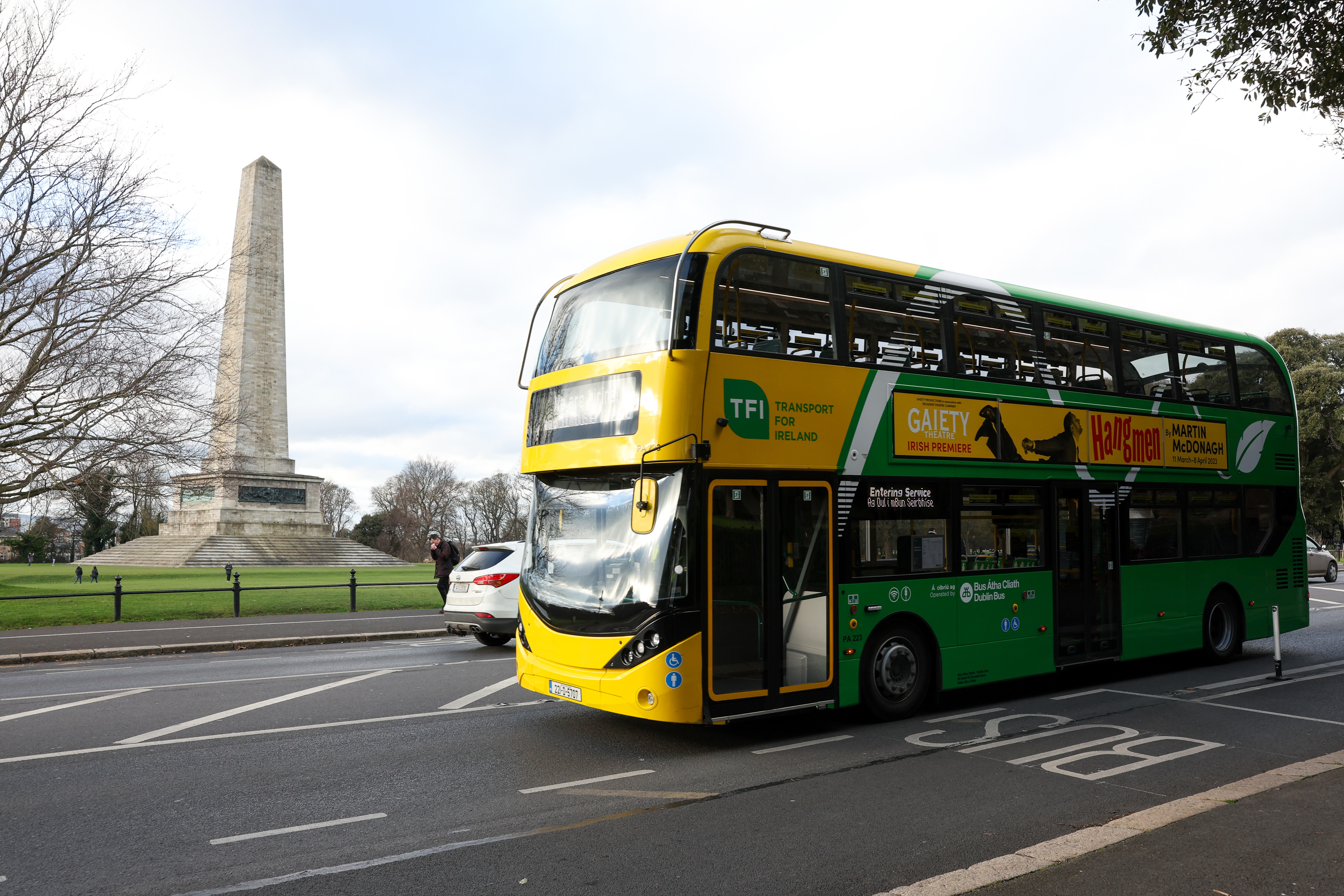 Dublin Bus in motion driving through Phoenix Park