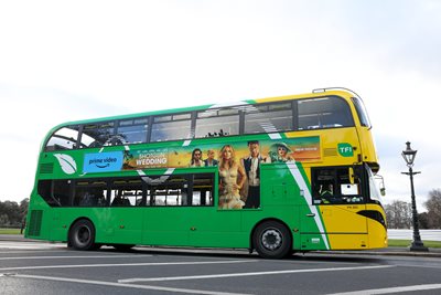 Image of a Dublin Bus from the side, yellow and green bus colour.