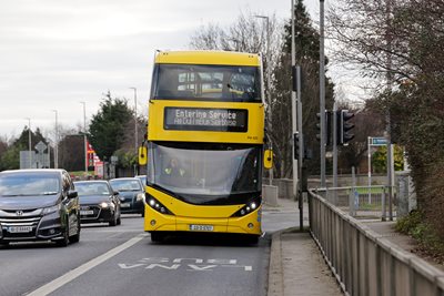 Image of front of a bus driving in the bus lane