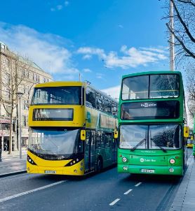 Image of a Dublin Bus and a DoDublin open top bus on O'Connell Street