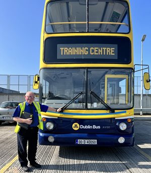 Image of Billy Fleming, Training Centre in front of a Dublin Bus training bus