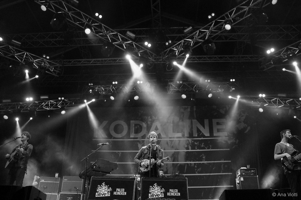 Image of Kodaline on stage playing guitar