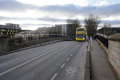 Dublin Bus driving over a bridge 