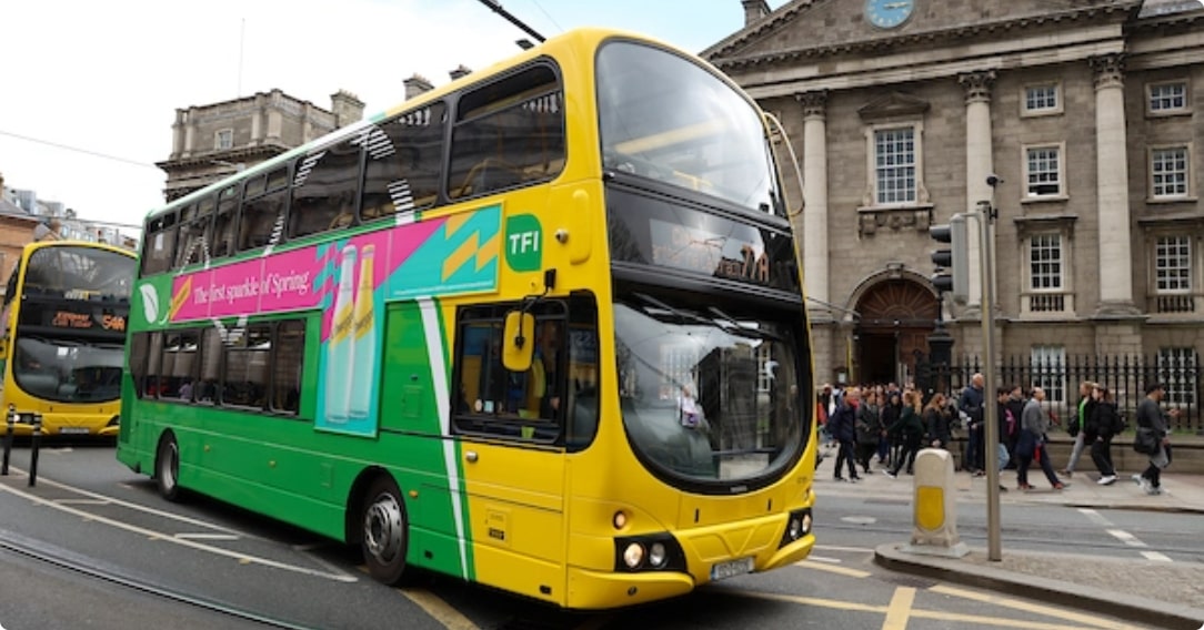 Image of bus driving through city